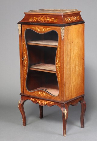 An Edwardian shaped inlaid mahogany display cabinet with brass 3/4 gallery, fitted shelves enclosed by a glazed panelled door, having gilt metal mounts throughout, raised on cabriole supports 130cm h x 63cm w x 40cm d 