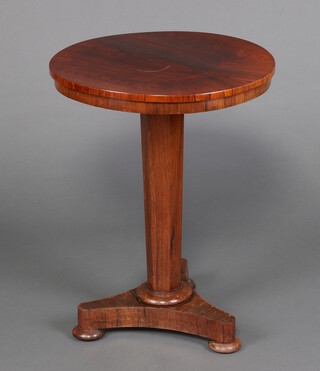 A William IV circular rosewood wine table, raised on a chamfered waisted column with triform base 71cm h x 55cm diam. 