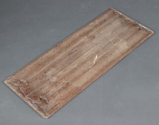 A carved oak linen fold panel 80cm h x 32cm w