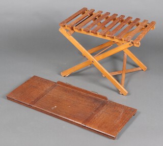 A rectangular slatted pine luggage rack 42cm h x 59cm w x 43cm d, together with a folding oak book stand 5cm x 84cm x 33cm 