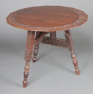 A Victorian carved oak drop flap table with shaped top, raised on 3 (later) turned supports  70cm h x 89cm w x 91cm d (top is split and warped)