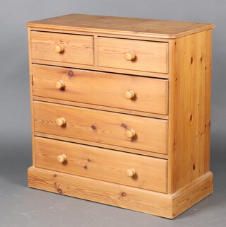 A Victorian style pine chest of 2 short and 3 long drawers with turned handles, raised on a platform base 93cm h x 91cm w x 45cm d 