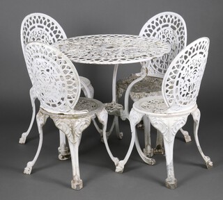 A Victorian style white painted pierced aluminium garden suite comprising circular pedestal table 71cm h x 74cm diam. together with 4 white painted chairs on cabriole supports 85cm h 