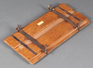 A 1930's iron and oak trouser press 72cm h x 35cm 