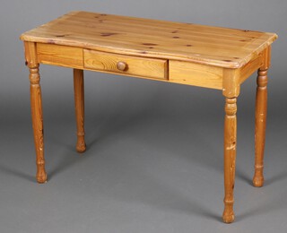 A rectangular pine side table fitted a drawer 71cm h x 100cm w x 48cm d 