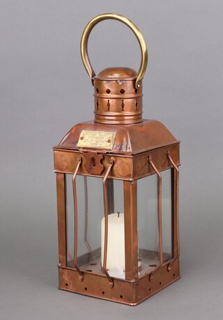 A reproduction square copper lantern marked Cargo Light 1939 33cm h x 13cm w x 13cm d 