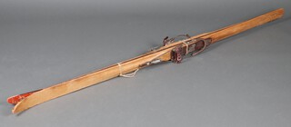 A pair of vintage wooden skis 210cm l 