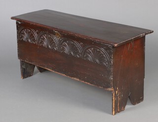 A 16th Century style panelled coffer with hinged lid and arcaded carved panel to the front, 54cm h x 113cm w x 42cm d (a/f)