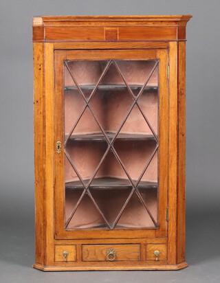 A Georgian mahogany hanging corner cabinet fitted shelves enclosed by astragal glazed panelled door, the base fitted 3 drawers 119cm h x 74cm w x 51cm d 