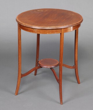 A circular Edwardian inlaid mahogany 2 tier occasional table on outswept supports 71cm h x 59cm diam. (water and contact marks in places)