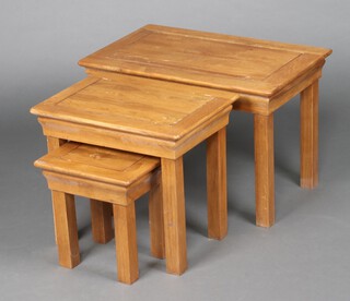 A nest of 3 rectangular light oak coffee tables on square supports 46cm h x 68cm w x 42cm d 