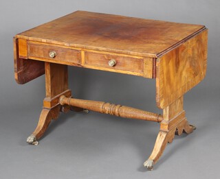 A Georgian walnut and crossbanded rosewood sofa table, fitted 2 frieze drawers and raised on turned supports and stretcher 71cm h x 89cm w (top is warped, veneer missing from the edge)