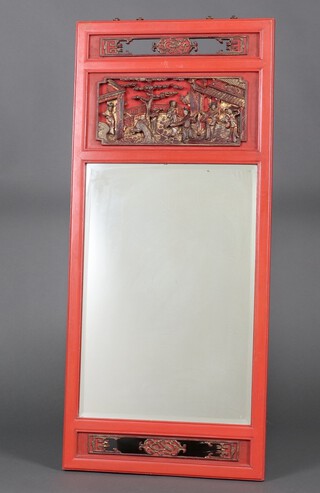 A rectangular plate mirror contained in a Chinese carved red wooden frame 107cm x 47cm 