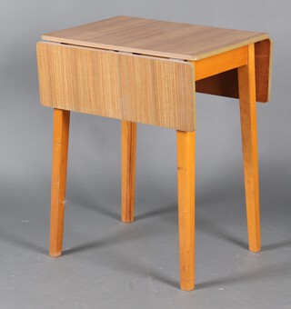 A drop flap kitchen table with laminate/formica top