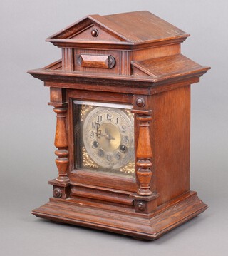 Junghan, an Edwardian bracket clock with gilt dial and silvered chapter ring, contained in an oak architectural case 38cm x 26cm x 21cm 