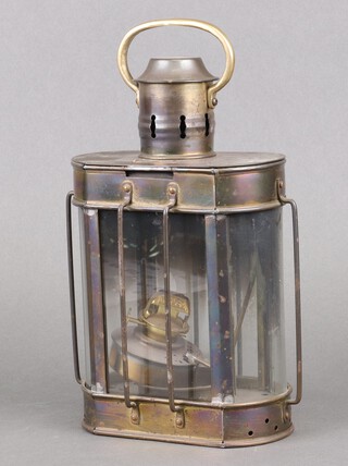 An oval reproduction brass lantern 26cm x 15cm x 9cm