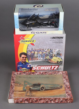An Redna Series  Bluebird Speed Cross Daytona Sands 210 piece jigsaw, a Sunoco Dave Schultz Limited Edition 1.9 scale motorcycle and an Ogate Ski-Doo boxed 