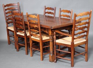 A 17th Century style oak dining suite comprising refectory dining table raised on turned supports with H framed stretcher, the top formed of 5 planks, 77cm h x 160cm l x 84cm w, together with a set of 6  ladder back dining chairs with woven rush seats 