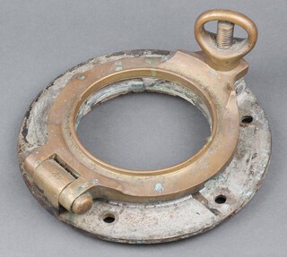 A gilt metal port hole (no glass) 25cm diam. 