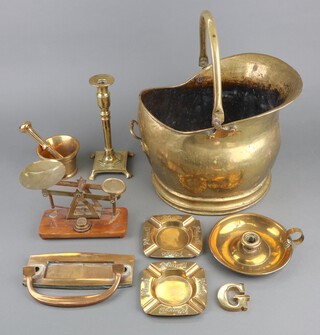 A brass coal scuttle, a set of scales and other items of brassware 