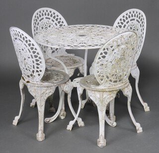 A Victorian style white painted pierced aluminium garden suite comprising circular pedestal table 71cm h x 74cm diam. together with 4 white painted chairs on cabriole supports 85cm h 