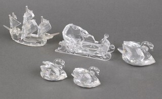 A Swarovski Crystal  galleon 9cm, a sledge and 3 swans