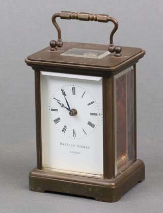 A brass cased carriage timepiece by Matthew Norman, London, 15cm to handle 
