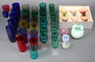 Thirteen Victorian green glass wine glasses (small) and other items of coloured glassware