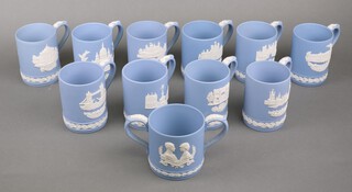 Eleven pale blue Wedgwood Jasperware commemorative mugs 