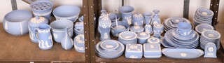 A Wedgwood pale blue Jasper vase, a lidded box and cover, bowls, platters and dishes 