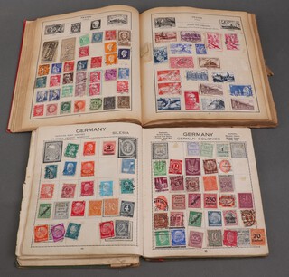 A Strand stamp album of world stamps and The Welcome Illustrated stamp album with world stamps 