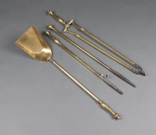 A brass 3 piece fireside companion set with shovel, poker (f) and pair of tongs together with 1 other poker 