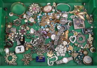 A carved gilt cameo brooch and a quantity of costume jewellery and badges