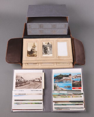 Brevete S.G.D.G, a brown plush photograph album containing 54 black and white photographs of buildings, soldiers, figures, birds nests etc, together with 3 albums of approx 162 black and white and coloured postcards of English resorts and historical buildings 