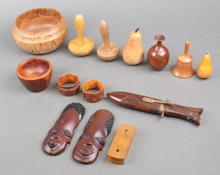 A turned walnut bowl and a collection of treen ware 