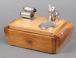An Art Deco cigarette box calendar with chrome figure of a seated bulldog 