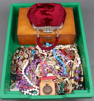 A 1920's clutch purse, a quantity of vintage costume jewellery including a mahogany box 