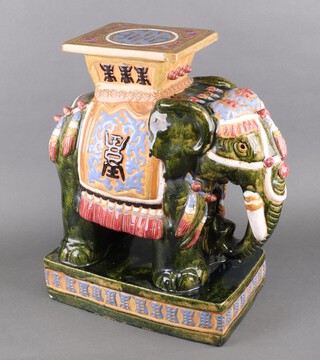 A modern Chinese ceramic garden seat in the form of a standing elephant 57cm 