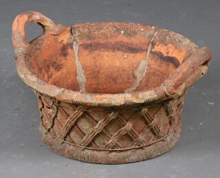 A 19th Century style circular terracotta twin handled urn in the form of a basket 19cm x 53cm (f and r)