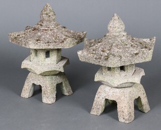 A pair of well weathered concrete hexagonal lanterns in the form of pagodas 40cm h x 32cm (in 4 sections) 