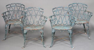 A set of 4 pierced cast iron garden chairs, raised on cabriole supports 80cm h x 60cm w x 51cm d  