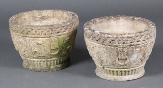 A pair of circular well weathered concrete garden planters with cast drop handles 24cm x 33cm 