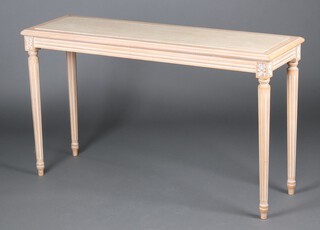 An Empire style rectangular limed oak side table with white veined marble top, raised on turned and fluted supports 74cm h x 99cm w x 39cm d 