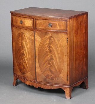 A Georgian style crossbanded mahogany bow front cabinet fitted 3 drawers above double cupboard, raised on bracket feet 92cm h x 81cm w x 40cm d  