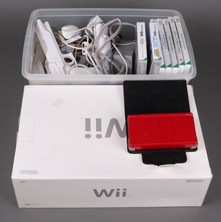 A Nintendo Wii and a Nintendo DS pocket game, with games