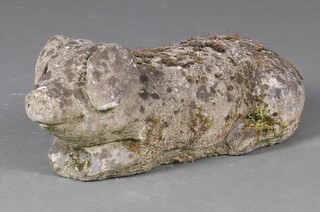 A well weathered concrete figure of a reclining pig 18cm x 52cm x 20cm 