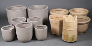 A collection of  well weathered circular resin garden planters - pair 25cm x 25cm, single 31cm x 32cm, 
pair with rope edge borders 33cm x 43cm, single 30cm x 43cm, hexagonal 34cm x 29cm x 44cm, a pair of Apta pots 31cm x 32cm, 1 other pair 43cm x 46cm and a garden planter in the form of a chimney pot 47cm h x 27cm 