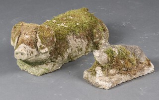 A well weathered concrete figure of a pig 18cm x 50cm x 15cm and a smaller ditto 11cm x 28cm x 12cm 