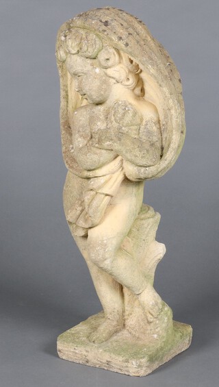 A well weathered concrete garden figure of a standing cherub depicting Winter 78cm h