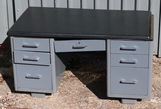 A mid-Century metal framed desk fitted 1 long and 9 short drawers 76cm h x 137cm w x 70cm d 